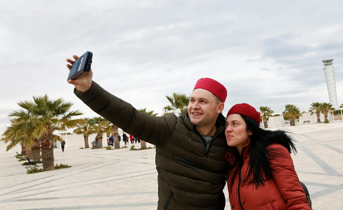 British tourists takes a selfie after arriving to Tunisia with the Thomas Cook travel agency at Enfidha Airport. (Reuters)