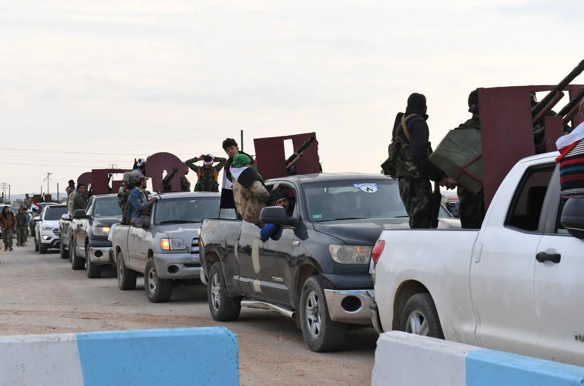A convoy of pro-Syrian government fighters arrives in Syria’s northern region of Afrin. Kurdish forces said in a statement that pro-regime fighters deployed to Syria’s Afrin region will take up positions and “participate in defending the territorial unity of Syria and its borders,” countering Turkey’s offensive on the area. (AFP)