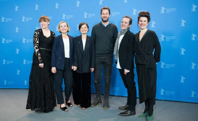 (L-R) Maria Dahlin, Danish actress Alba August, Danish film director Pernille Fischer Christensen, Norwegian actor Henrik Rafaelsen, Danish author and Screenwriter Kim Fupz Aakeson and Anna Anthony pose during the photo call for the film "Becoming Astrid" (Unga Astrid) presented in the "Berlinale special gala" category in Berlin on February 21, 2018. (AFP / Stefanie Loos)