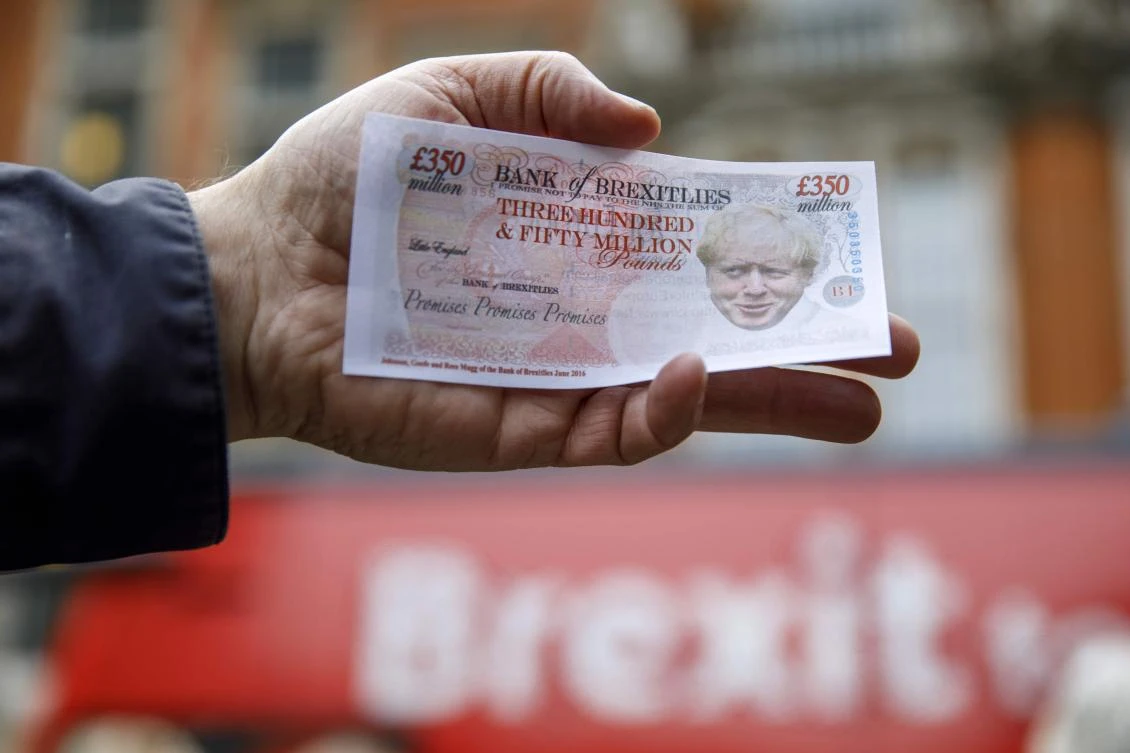 A campaigner holds fake £350 million notes featuring the face of Britain’s Foreign Secretary Boris Johnson as EU advocates launch the Brexit Facts Bus and kick off a new initiative against Brexit. Recruitment firm Hays expects that the UK’s departure from Europe will encourage builders from EU countries to leave. (AFP)