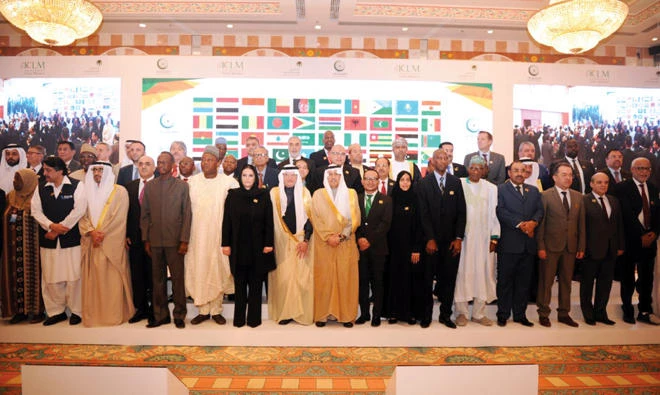 OIC Secretary-General Yousef Al-Othaimeen and labor ministers of the OIC member states pose for a group photo at the end of the 4th Islamic Conference in Jeddah on Thursday. (SPA)
