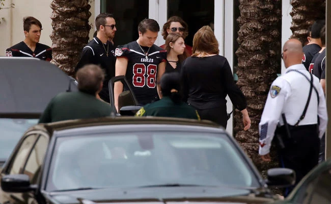 Mourners attend the funeral service of Aaron Feis, one of the victims of the mass shooting at Marjory Stoneman Douglas High School, in Coral Springs, Florida, on February 22, 2018. (REUTERS/Carlos Garcia Rawlins)