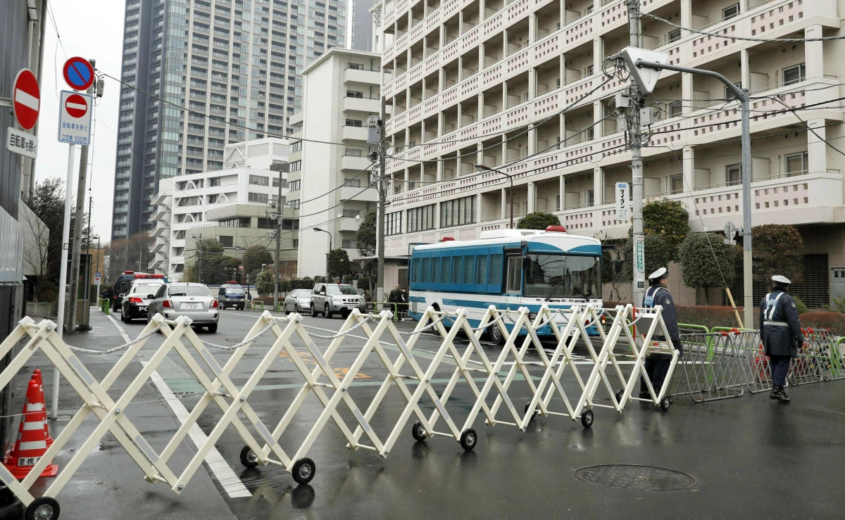 Police officers stand guard near the pro-Pyongyang General Association of Korean Residents in Japan, in Tokyo Friday, Feb. 23, 2018. (AP)