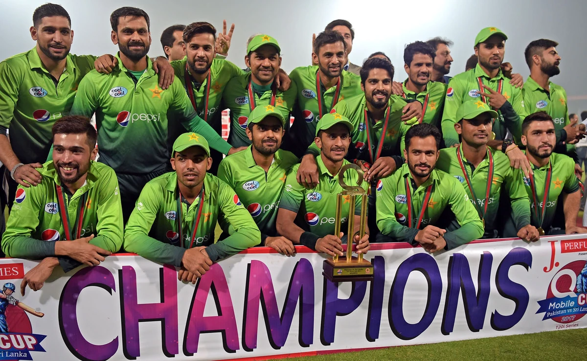 In this file photo, Pakistan’s cricket team members pose for photographs with the trophy after winning the third and final T20 cricket match against Sri Lanka, at the Qaddafi Cricket Stadium, in Lahore, on Oct. 29, 2017. (AFP)