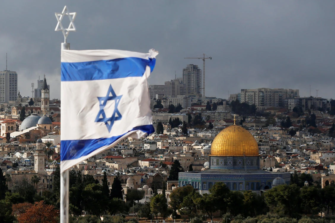 An Israeli flag is seen near the Dome of the Rock in Jerusalem’s Old City. The opening of the US Embassy in the city in May will coincide with the 70th anniversary of the founding of the State of Israel. (Reuters)
