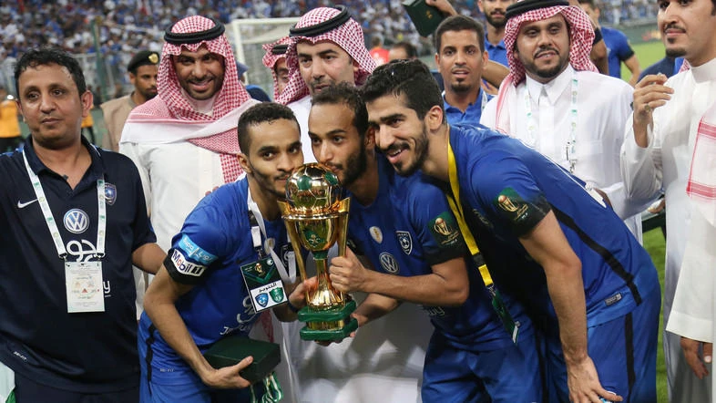 Al-Hilal celebrate winning the Saudi Pro League last season. They will be join in the league by 15 other teams next season. (AFP)