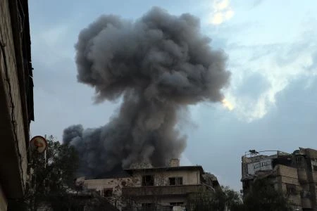 Smoke billows following a regime air strike on the rebel-held town of Haza, in the besieged Eastern Ghouta region on the outskirts of the capital Damascus, on February 23, 2018. (AFP)