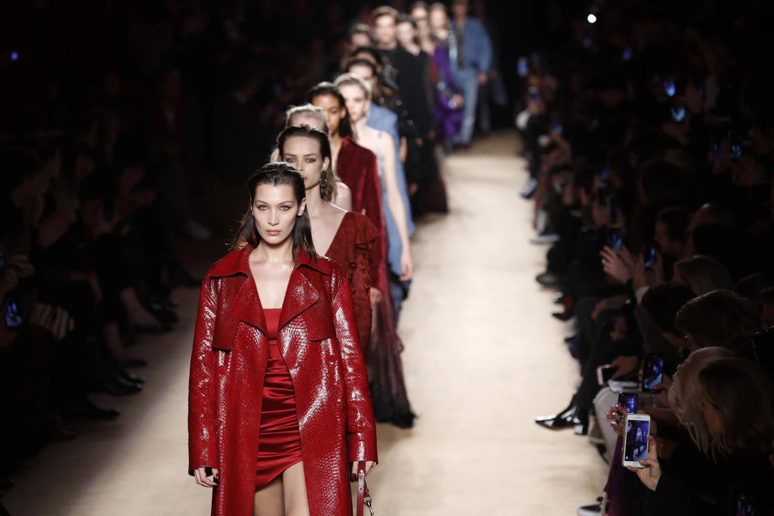 Model Bella Hadid, front, leads other models as they wear creations as part of the Roberto Cavalli women’s Fall/Winter 2018-2019 collection, presented during the Milan Fashion Week. Saudi Arabia is investing heavily in its own nascent industry. (AP)