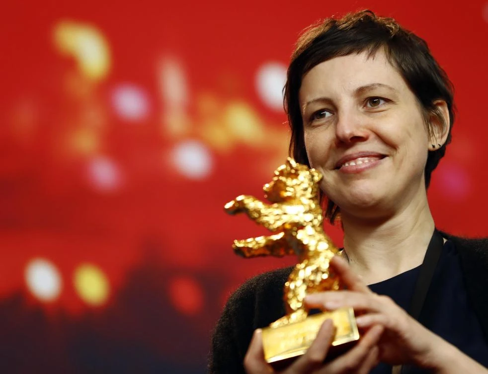 Director, screenwriter, editor and producer Adina Pintilie poses with her Golden Bear award for Best Film ‘Touch Me Not’ at the news conference after the awards ceremony at the 68th Berlinale International Film Festival in Berlin, Germany, February 24, 2018.(Reuters)