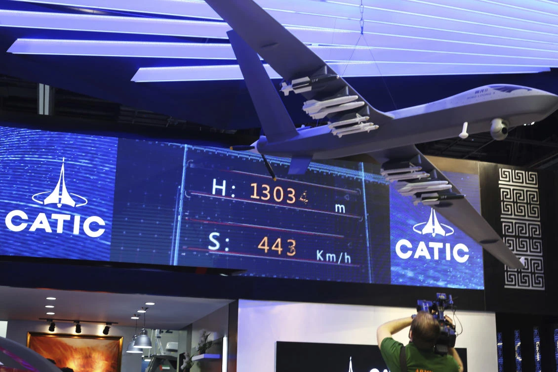 A model of a Wing Loong II weaponized drone hangs above the stand for the China National Aero-Technology Import & Export Corp. at a military drone conference in Abu Dhabi, United Arab Emirates, Sunday, Feb. 25, 2018. (AP)