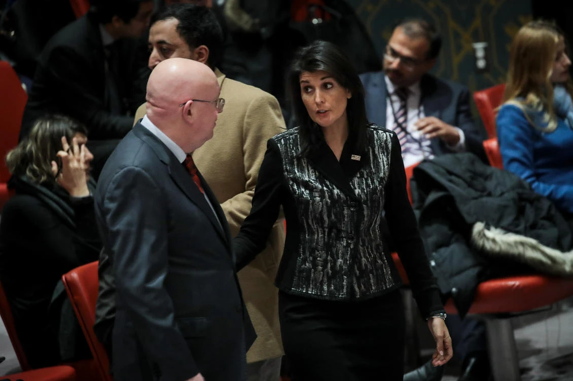 Russian Ambassador to the UN Vasilly Nebenzia talks with his US counterpart Nikki Haley before the start of a UN Security Council meeting concerning in Iran. (File Photo: AFP)