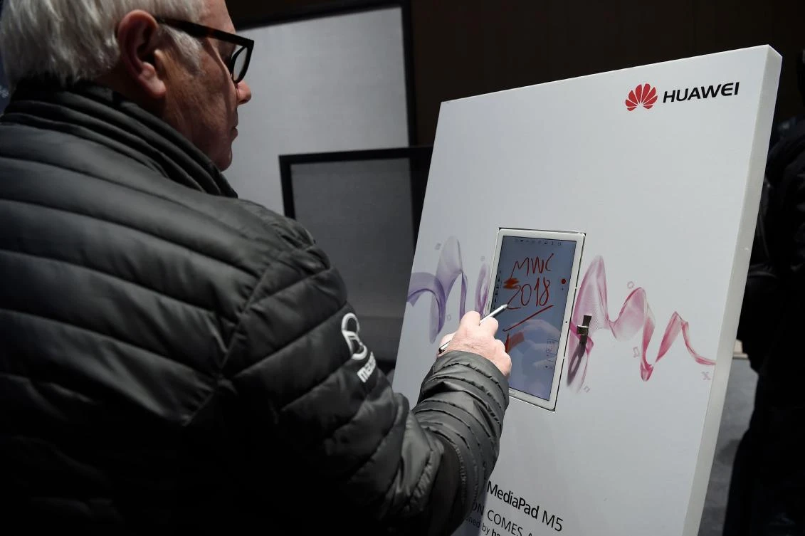 A man paints with the new Huawei MediaPad 5 M5 on February 25, 2018 at the Mobile World Congress (MWC) in Barcelona, on the eve of its inauguration. (AFP)