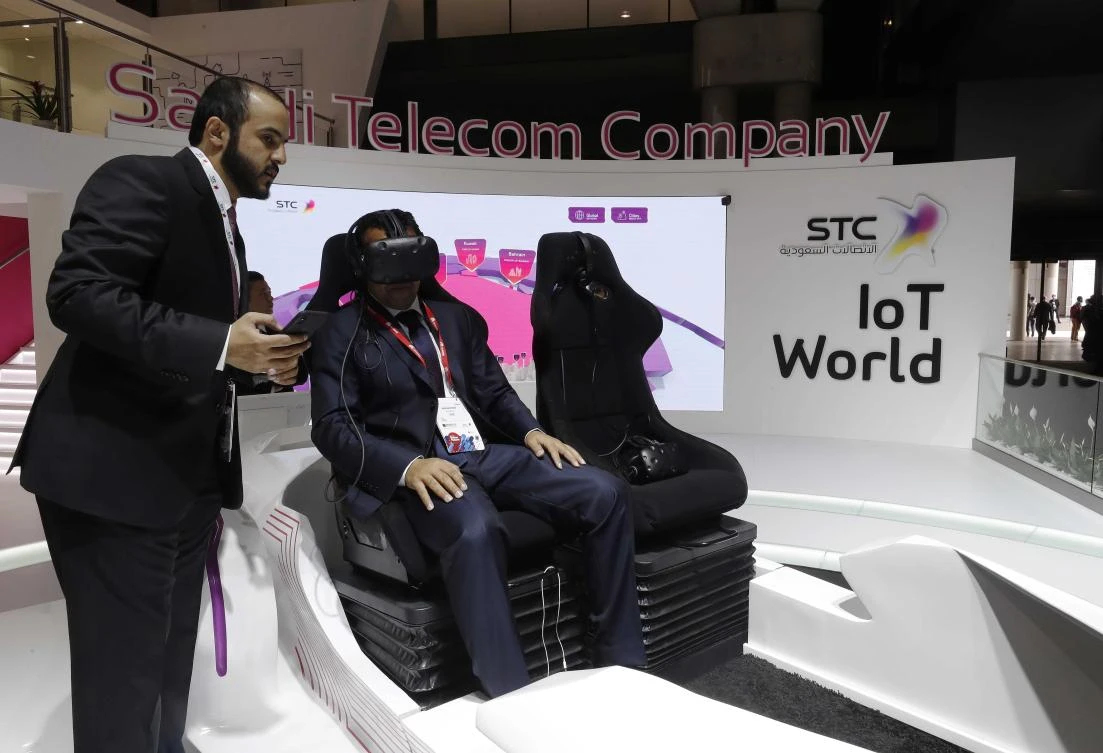 A 5G connected car simulator is displayed at the Saudi Telecom Company stand during the Mobile World Congress in Barcelona. (Reuters)