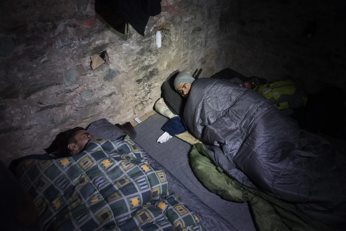 Migrants bed down inside an Ottoman Gun emplacement, built on the top of a Byzantine fortification, in the northern Greek city of Thessaloniki. Destitute migrants seek shelter in abandoned buildings or open spaces used by local homeless people, arriving and leaving during the night hours to avoid detection. (AP Photo)