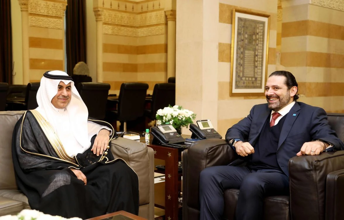 A handout picture from February 26, 2018 shows Lebanese Prime Minister Saad Hariri (R) meeting with head of the Saudi envoy Nizar al-Alula at the governmental palace in the capital Beirut. (AFP PHOTO / HO / DALATI AND NOHRA)