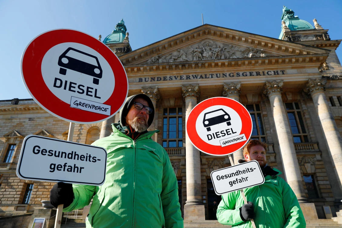 Greenpeace activists protest in front of Germany’s Federal Administrative Court before it decides whether there is legal basis for cities to ban diesel cars to help reduce air pollution on Tuesday, February 27. (Reuters)