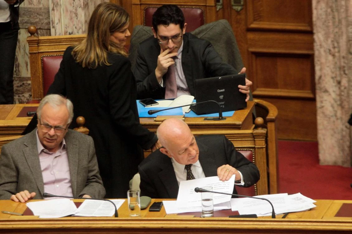 Greece’s junior labor minister, Rania Antonopoulos stands next to Greek Minister of Economy Dimitri Papadimitriou. Greece’s economy minister Papadimitriou quit hours after his wife was ousted as a junior minister over a housing stipend controversy. (AFP)