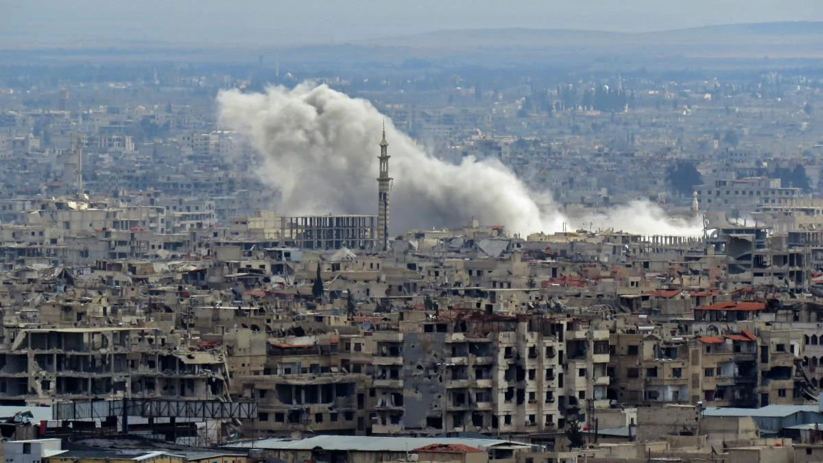 A general view taken from Damascus shows smoke rising from the rebel-held enclave of Eastern Ghouta following fresh air strikes and rocket fire on February 27, 2018. (AFP)