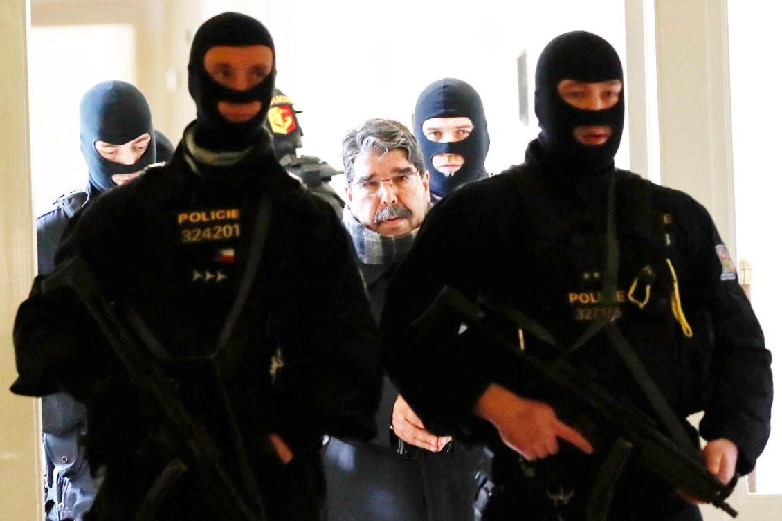 Syrian Kurdish leader Saleh Muslim, center, is escorted by Czech police for his trial at the municipal court on Tuesday in Prague. (AFP)