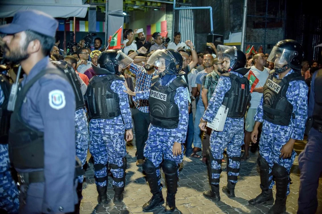 Maldivian opposition supporters scuffle with security forces officers during a protest demanding the release of political prisoners in Male. Maldives President Abdulla Yameen extended a draconian state of emergency by another month on February 20. (AFP)
