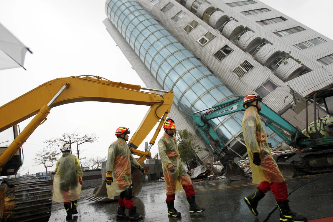 Above, rescuers continue a search operation at an apartment building that collapsed after a strong earthquake in Hualien County, eastern Taiwan in this February 7 photo. (AP)