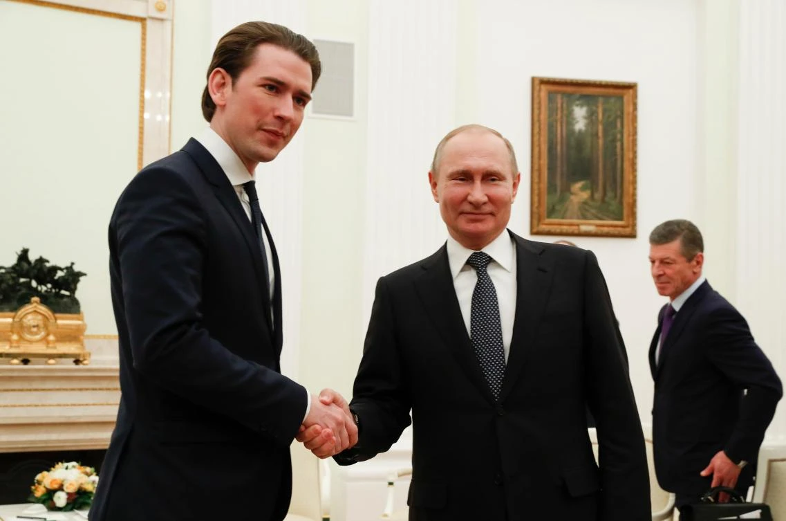 Russian President Vladimir Putin shakes hands with Austrian Chancellor Sebastian Kurz during a meeting at the Kremlin in Moscow on Feb 28, 2018. (AFP)