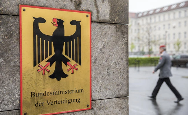 This May 4, 2017 file photo shows a soldier on his way to the Defense Ministry in Berlin, Germany. (Michael Kappeler/DPA via AP)