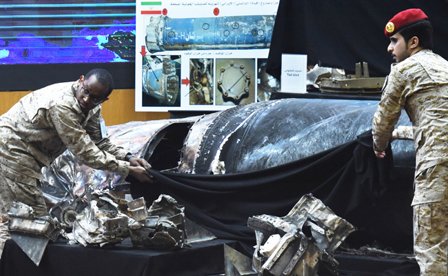 Saudi soldiers display the remains of Iranian-made Houthi ballistic missiles at a press conference in Riyadh. The Houthis have the capacity to build the basic missile frame and the basic weaponry, but they need the advanced technology that Iran provides, Roule said. (AFP)