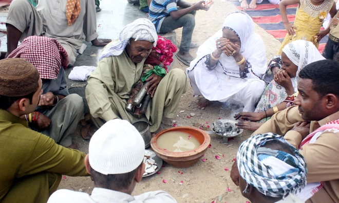 Traditional drink called ‘Piala’, literally translating as ‘cup’ in local language, which is made up of almond and pistachio is ready for distribution.