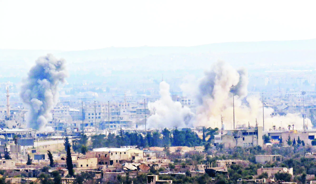 A picture taken from a regime-controlled area on the outskirts of Harasta on the northeastern suburbs of Damascus on Wednesday, shows smoke rising from areas targeted by regime forces shelling in the towns of Douma and Harasta. (AFP)