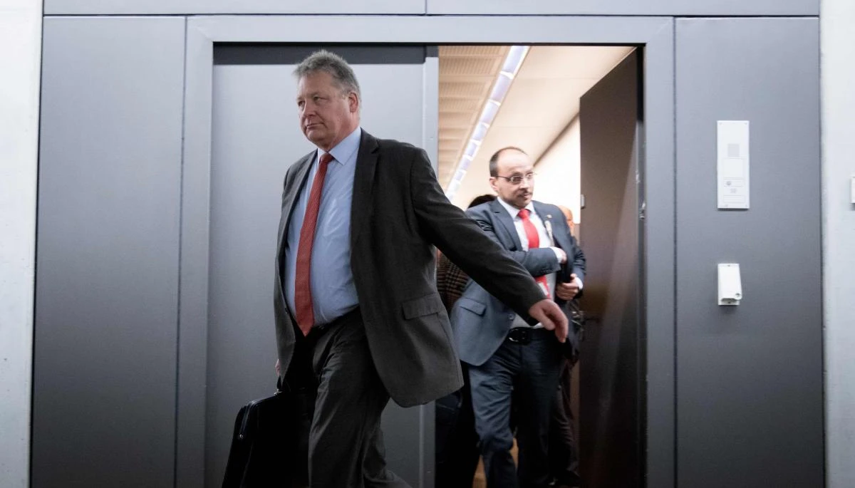 President of the German Federal Intelligence Agency (BND) Bruno Kahl, left, leaves parliament in Berlin after Russian hackers had infiltrated Germany’s foreign and interior ministries’ online networks. (AFP)