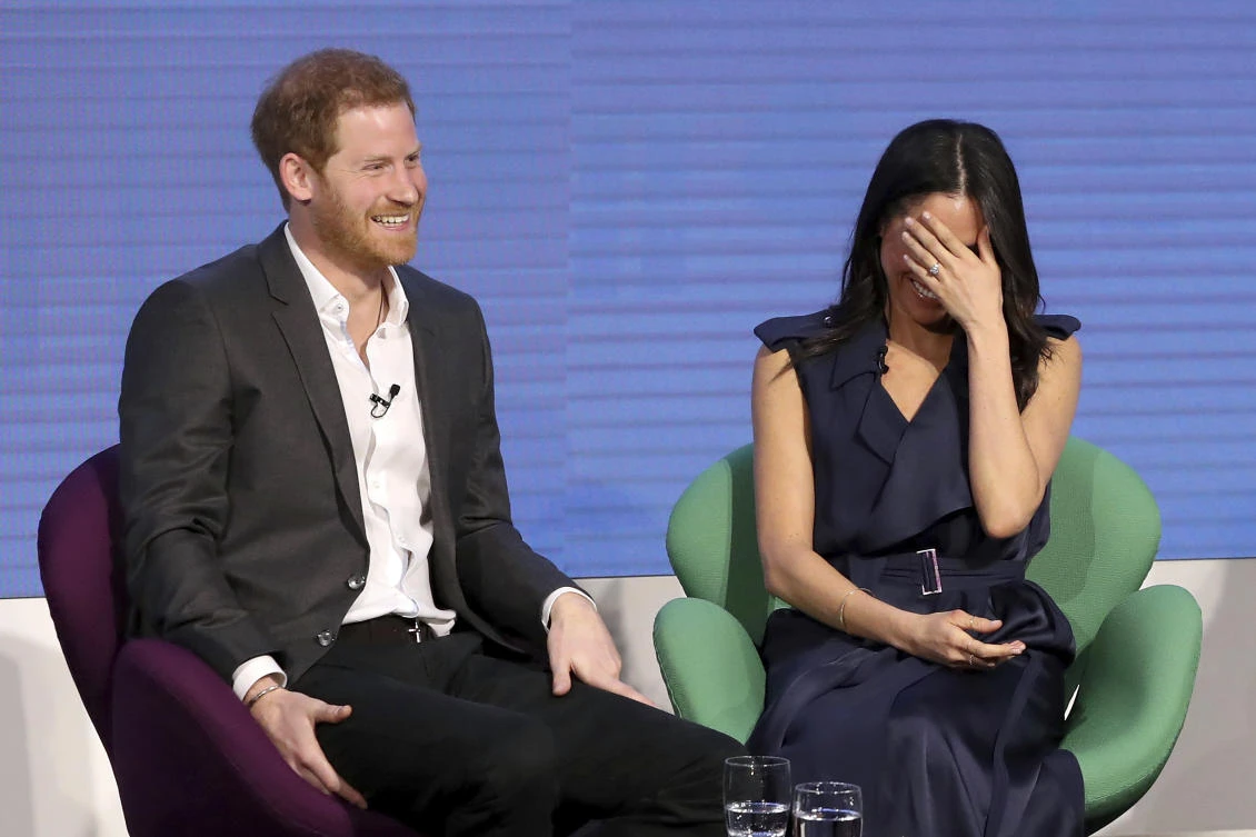 Britain’s Prince Harry and Meghan Markle laugh during the first annual Royal Foundation Forum in London on Wednesday, Febuary 28. The two have invited 2,640 people to the grounds of Windsor Castle to help celebrate their wedding. (AP)