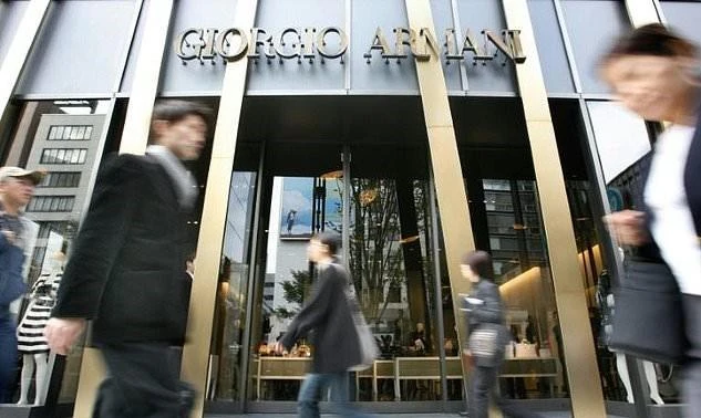 Tokyo school hires guards after Armani uniform furor