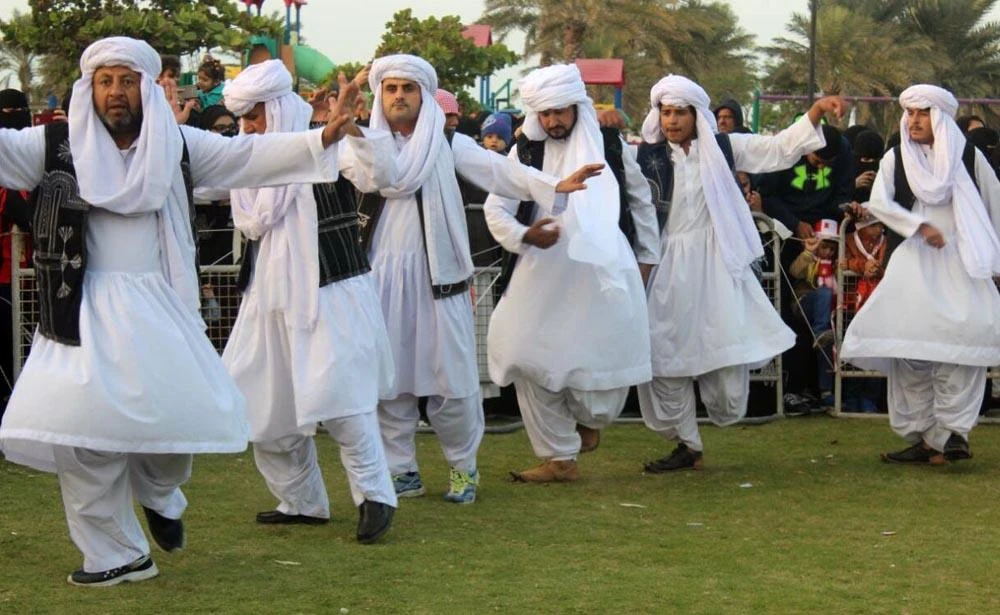 Baloch men dressed in their traditional dress and turban perform their folk dance in a ceremony held at Baloch House. (Photo courtesy: Baloch House)