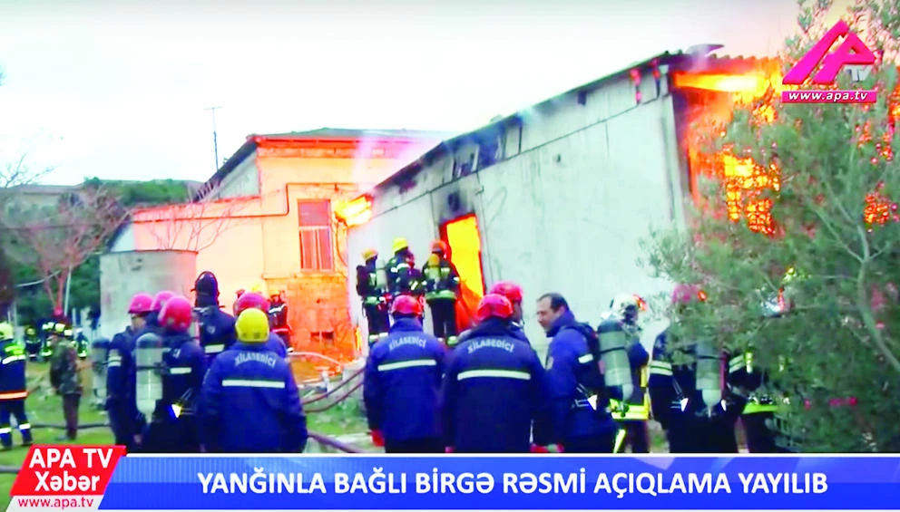 In this video grab, firefighters work at the scene of a fire at a drug rehabilitation clinic in Baku, Azerbaijan, on Friday. (AP)