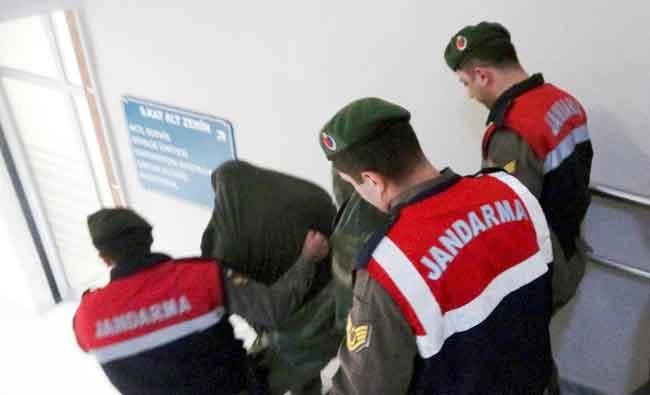 Turkish paramilitary police officers escort Greek soldiers Aggelos Mitretodis and Dimitros Kouklatzis in Edirne, Turkey, in this March 2, 2018 photo. (AP)