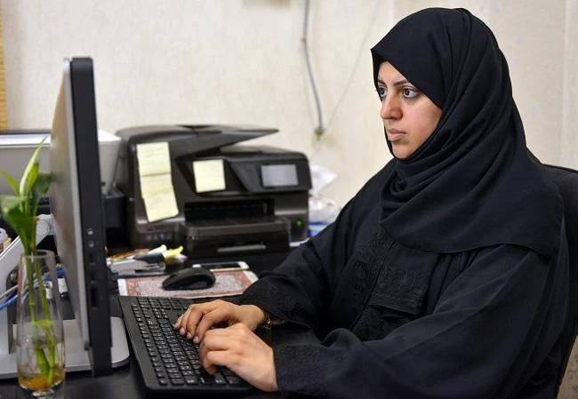Nassima Al-Sadah working at her office in Saudi Arabia. (AFP)