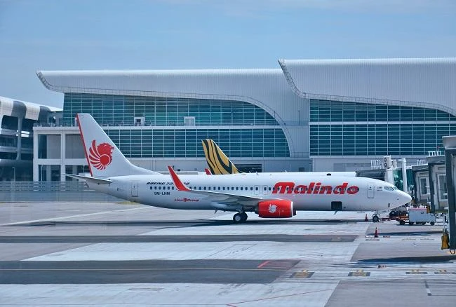 Not cleared for takeoff: Passenger tied up after stripping naked