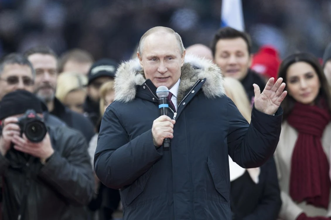 Russian President Vladimir Putin gestures while speaking during a massive rally in his support as a presidential candidate at the Luzhniki stadium in Moscow, Russia, Saturday, March 3, 2018. (AP)