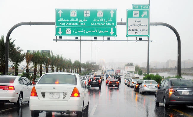 Saudi drivers take a flooded street in Jeddah, in this on November 21, 2017 file photo. (AFP)