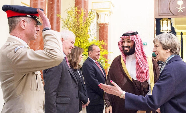 A handout photo provided by the Saudi Royal Palace on April 4, 2017 shows Saudi Crown Prince Mohammed bin Salman (2nd L), the Kingdom's defence minister, and British Prime Minister Theresa May (R) greeting officials in the capital Riyadh. (AFP)