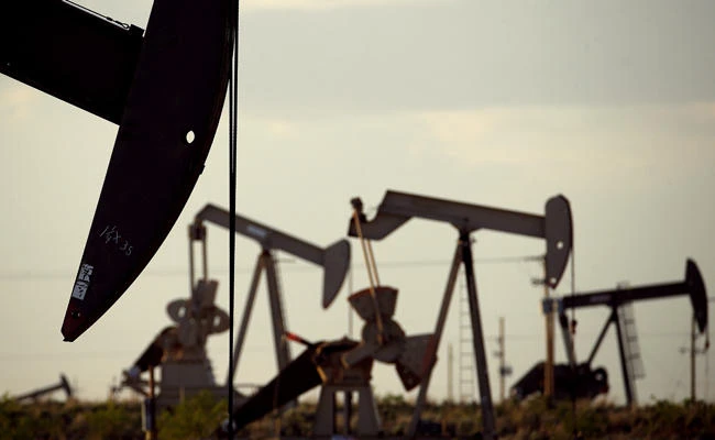 In this April 24, 2015 file photo, pumpjacks work in a field near Lovington, New Mexico, US. (AP Photo/Charlie Riedel, File)