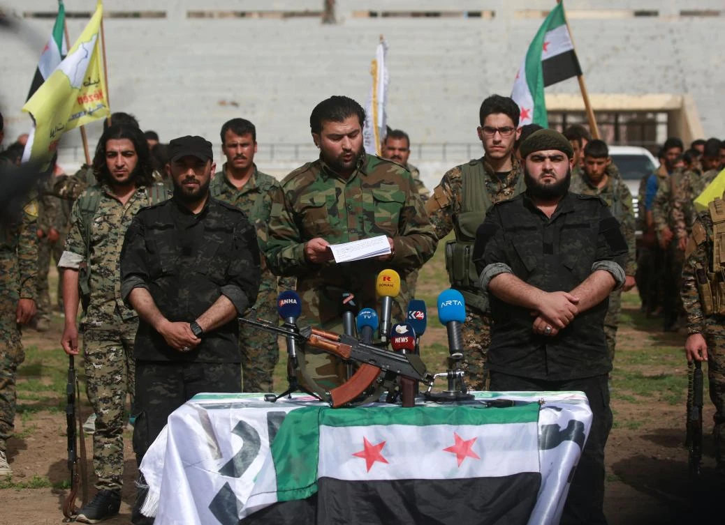 Syrian Democratic Forces (SDF) commander Abu Omar al-Idlibi speaks during a press conference at a football stadium in Raqa on March 6, 2018. (AFP)