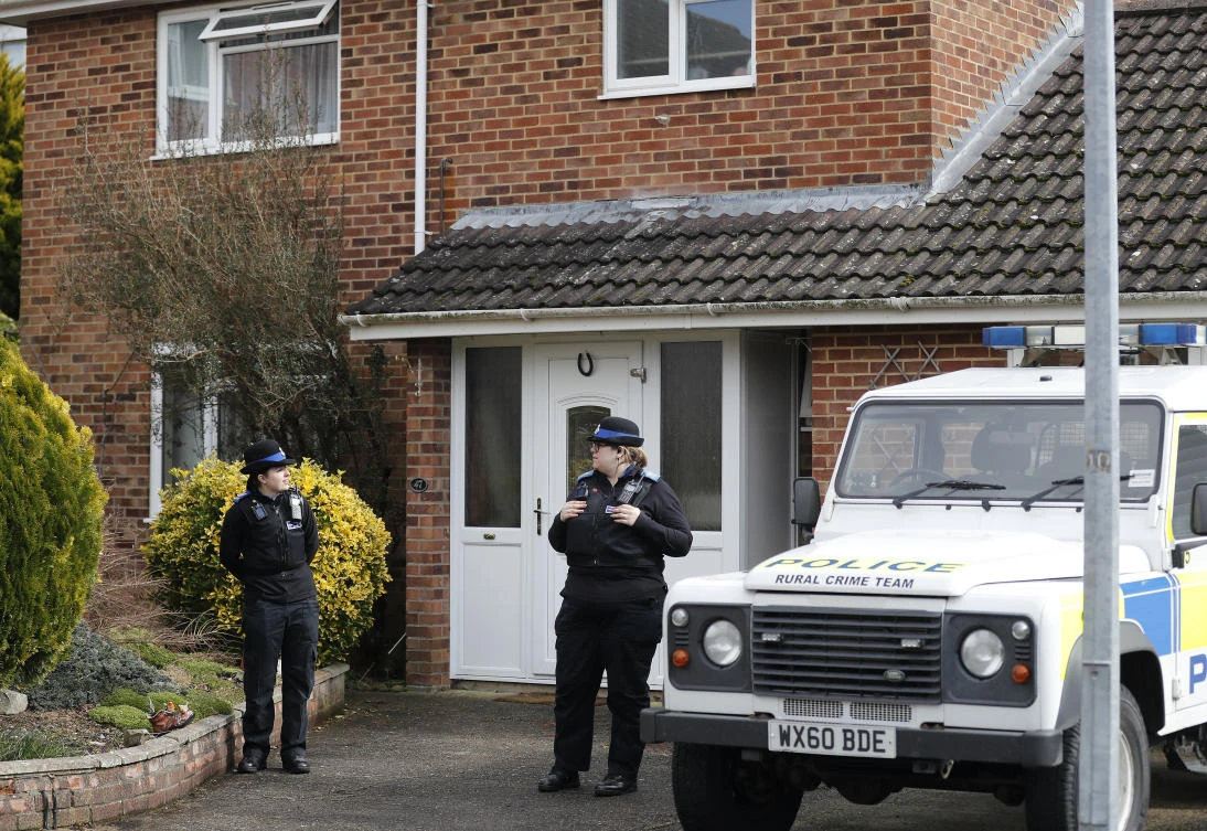 Police officers stand outside the house of former Russian double agent Sergei Skripal who was found critically ill Sunday following exposure to an “unknown substance” in Salisbury, England, Mar 6, 2018. (AP)