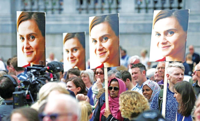 This file photo taken on June 22, 2016 shows people attending a commemorative event to celebrate the life of murdered Labour MP Jo Cox in Trafalgar Square, central London. (AFP)
