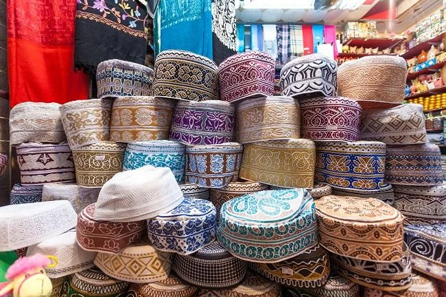 Traditional Omani kuma hats for sale at the souq in Muscat. (Shutterstock)