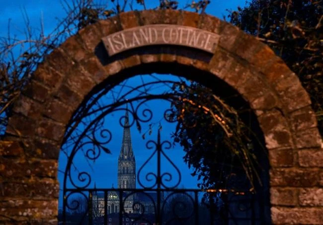 Salisbury Cathedral, which former Russian intelligence officer Sergei Skripal and his daughter were found unconscious after they had been exposed to an unknown substance, is seen through a door archway at dusk in Salisbury. (Reuters)