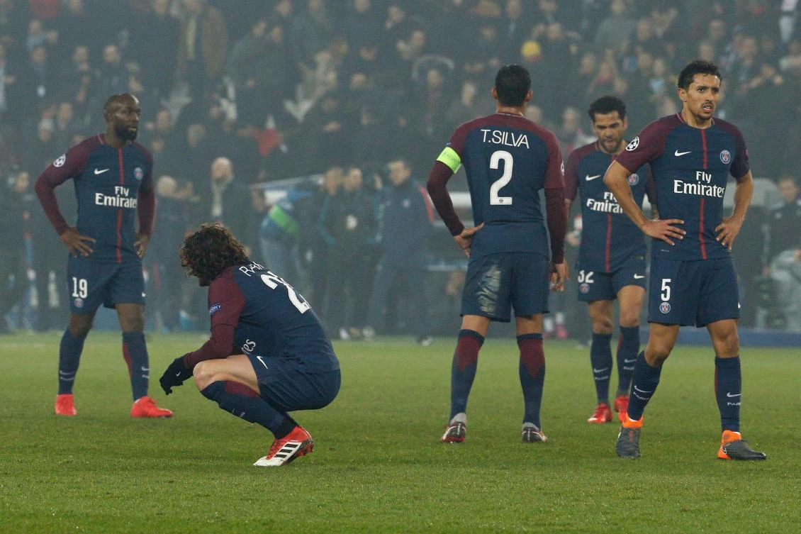 Paris Saint-Germain's players react after losing the Champions League round of 16 second-leg tie with Real Madrid. (AFP)