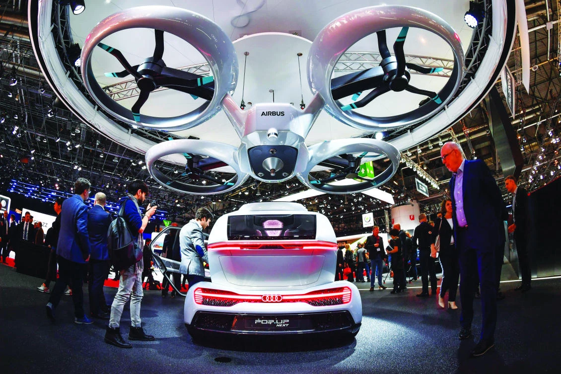 The “Pop.up next” concept flying car, a hybrid vehicle that blends a self-driving car and passenger drone by Audi, Italdesign and Airbus is seen during the Geneva International Motor Show. (AFP)