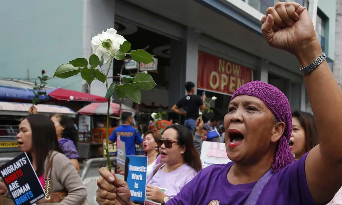 Hundreds of female activists in pink and purple shirts protested against President Rodrigo Duterte in the Philippines on Thursday. (AP)